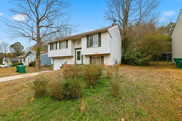 a front view of a house with a yard