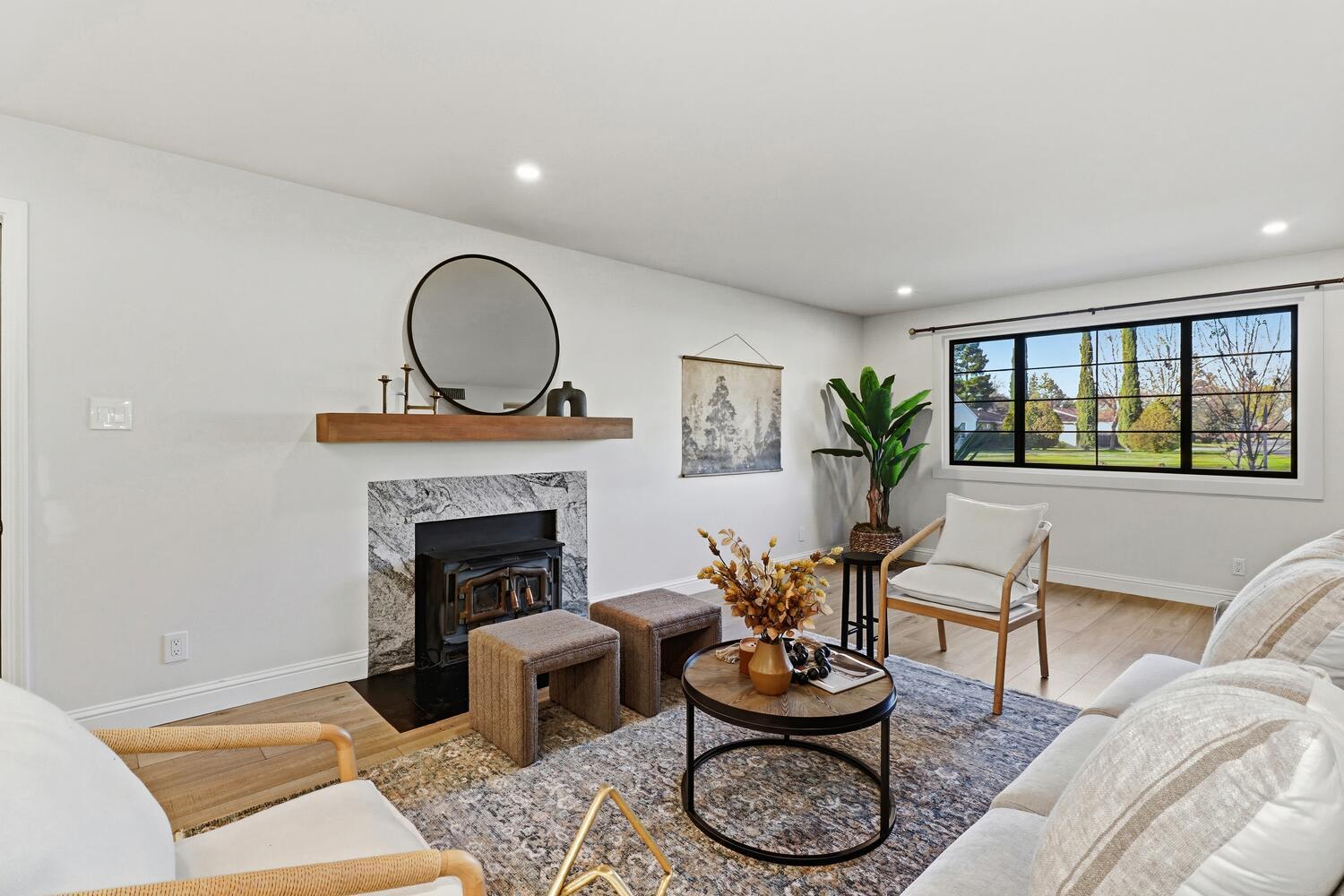 2860 Tioga Way Sacramento, CA 95821 - Photo 12 of 53 a living room with furniture a window and a fireplace