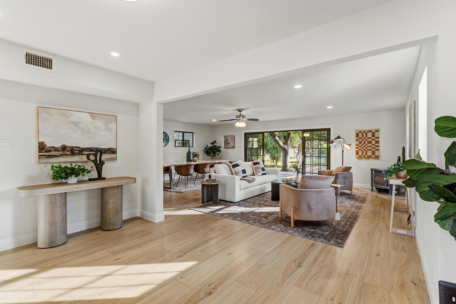 2860 Tioga Way Sacramento, CA 95821 - Photo 13 of 53 a living room with furniture a large window and wooden floor