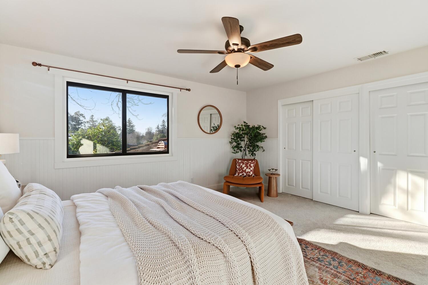 2860 Tioga Way Sacramento, CA 95821 - Photo 26 of 53 a bedroom with a large bed and a chandelier