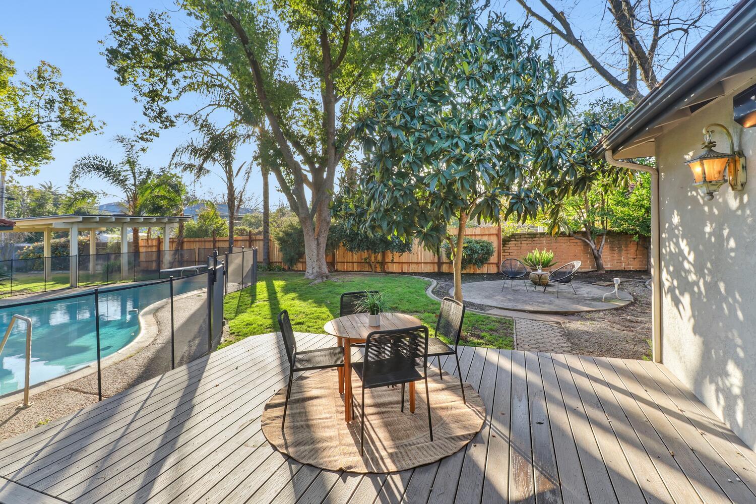 2860 Tioga Way Sacramento, CA 95821 - Photo 41 of 53 a view of a patio with a table chairs and a patio