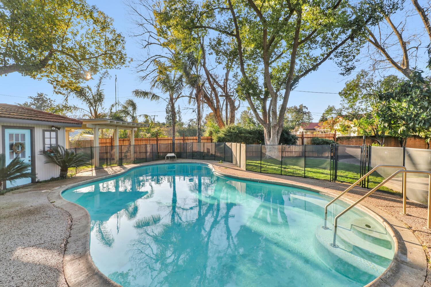 2860 Tioga Way Sacramento, CA 95821 - Photo 42 of 53 a view of a swimming pool with a patio