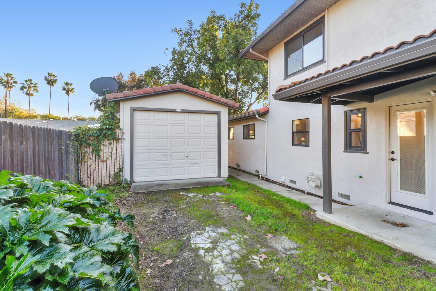 2860 Tioga Way Sacramento, CA 95821 - Photo 52 of 53 a view of a house with a small yard and wooden fence