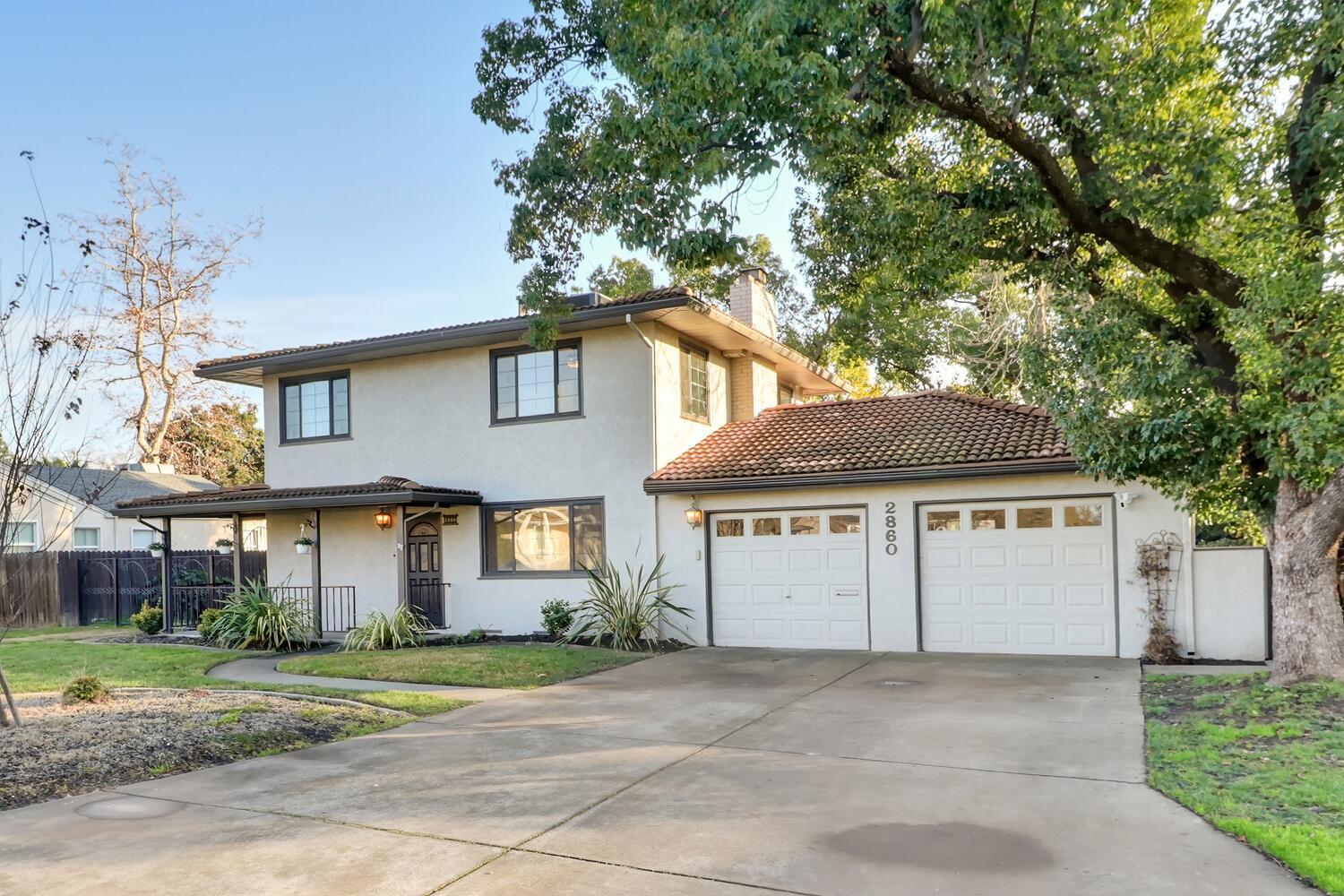 2860 Tioga Way Sacramento, CA 95821 - Photo 7 of 53 a front view of a house with a garden
