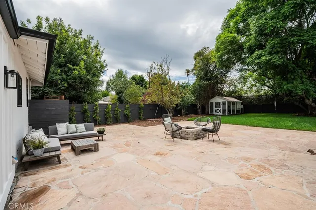 a view of a patio with a table and chairs in patio
