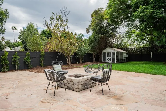 a view of backyard with seating space