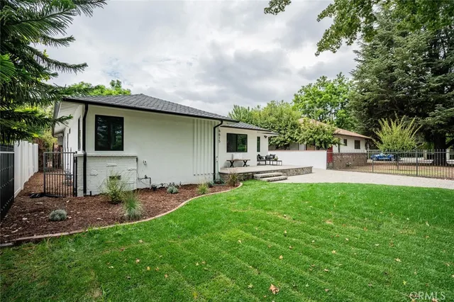 a view of a house with a fence