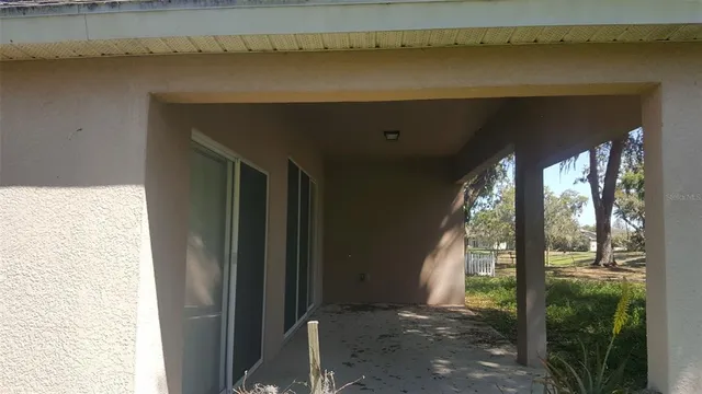 a view of swimming pool with chairs