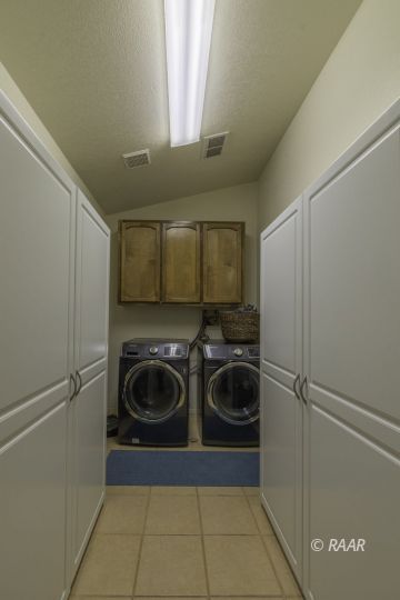 815 James Street Ridgecrest, CA 93555 - Photo 9 of 27 a utility room with sink dryer and washer