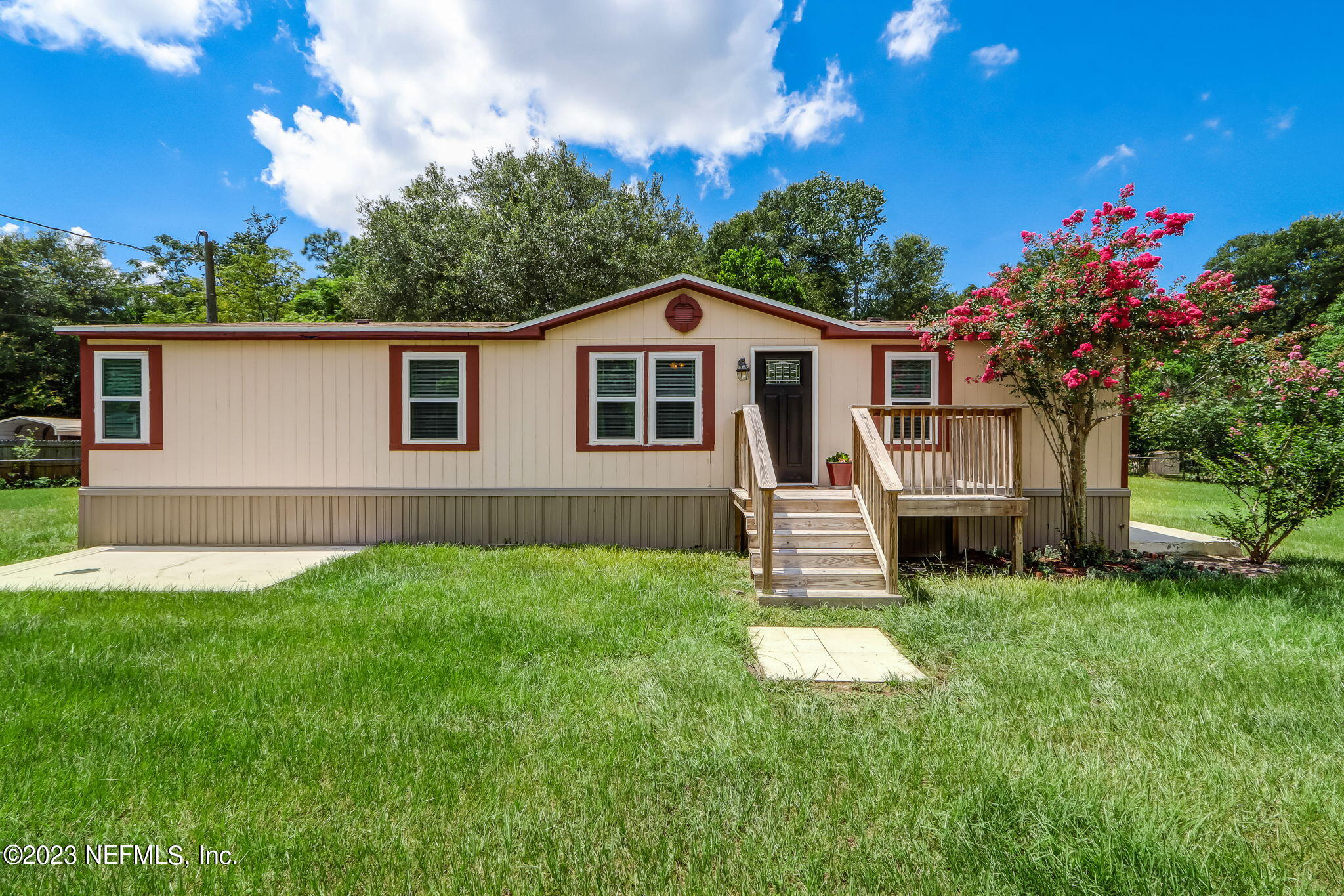 11480 Kaleel Road Jacksonville, FL 32218 - Photo 1 of 31 a front view of a house with a garden