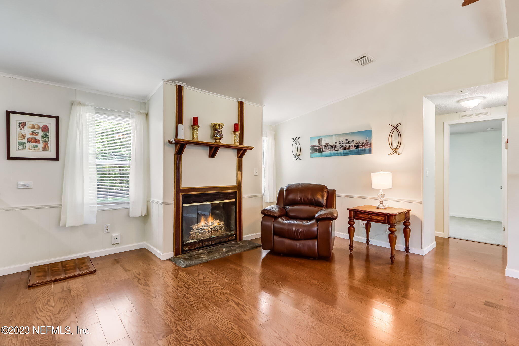 11480 Kaleel Road Jacksonville, FL 32218 - Photo 13 of 31 a living room with furniture and a fireplace