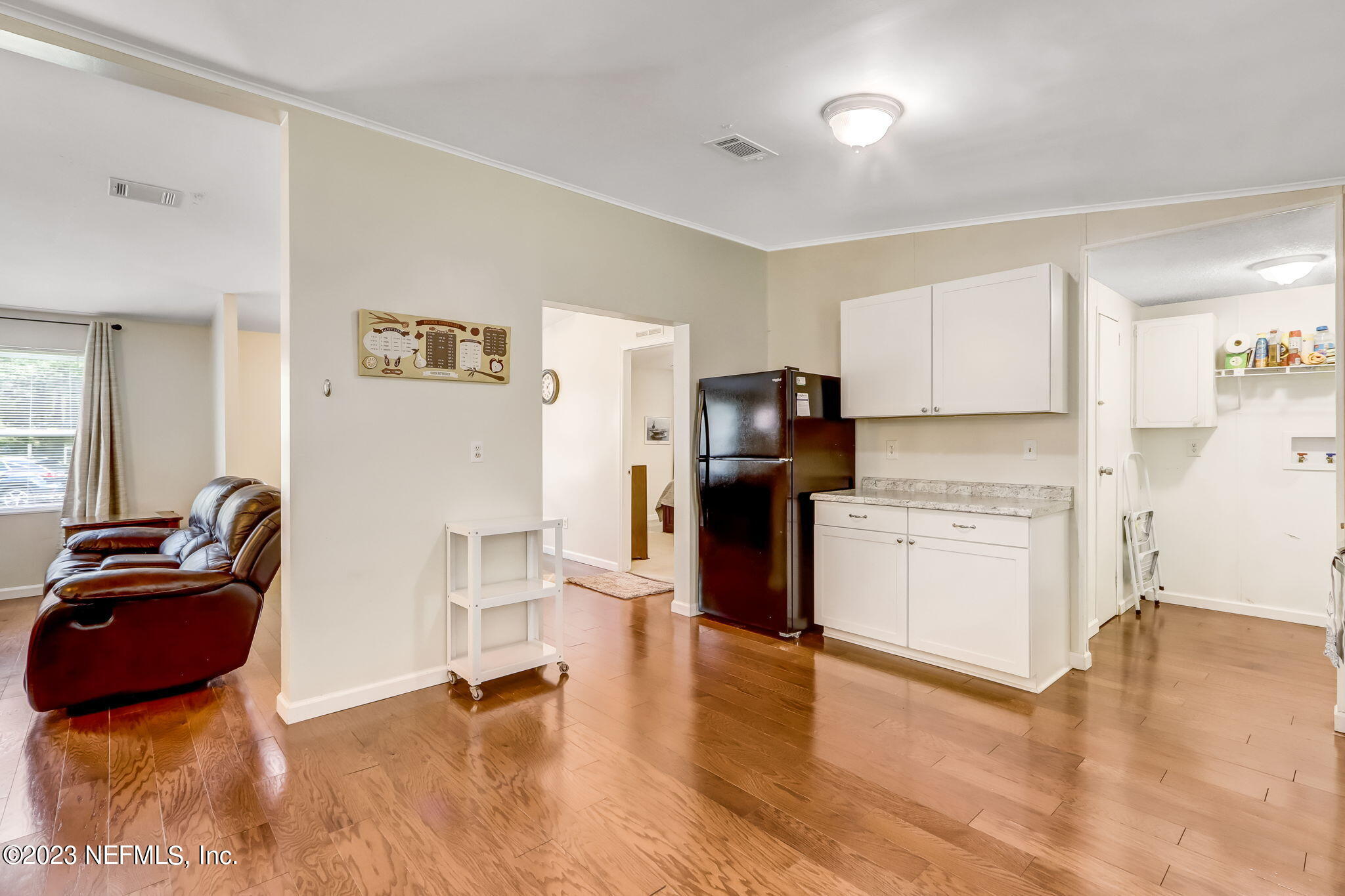 11480 Kaleel Road Jacksonville, FL 32218 - Photo 15 of 31 a living room with stainless steel appliances kitchen island granite countertop a refrigerator and a stove top oven