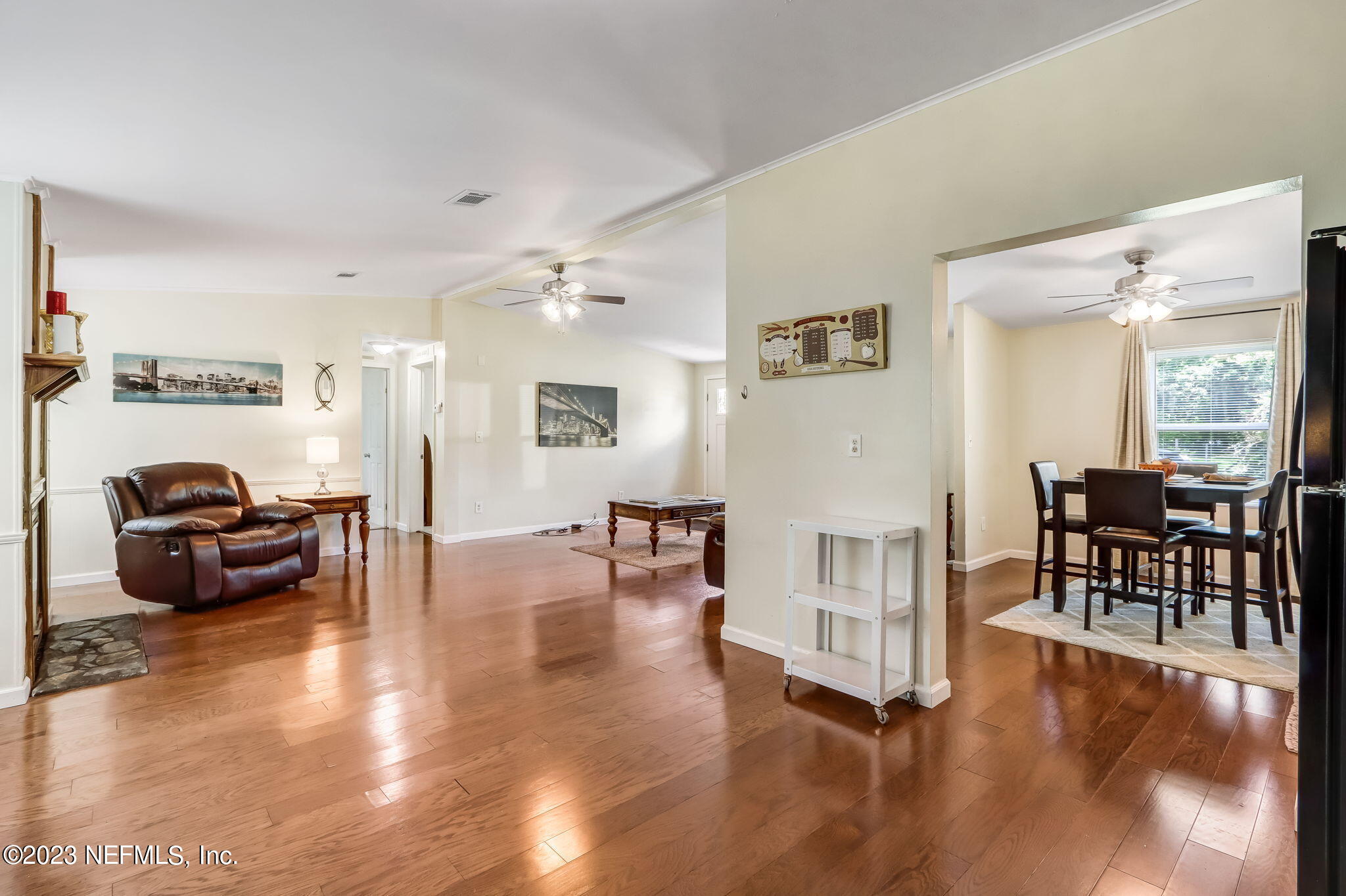 11480 Kaleel Road Jacksonville, FL 32218 - Photo 17 of 31 a living room with furniture and a table with wooden floor