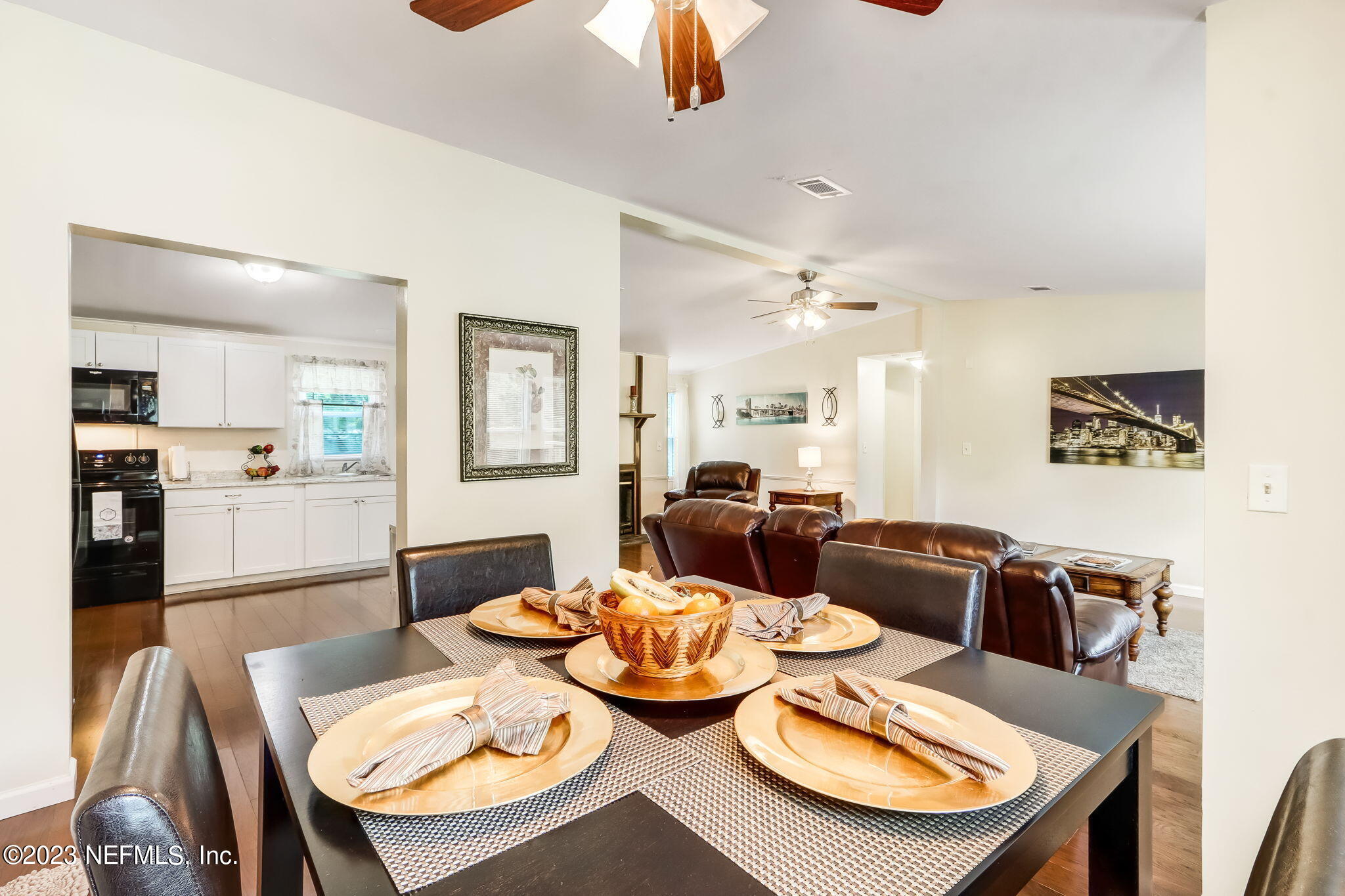 11480 Kaleel Road Jacksonville, FL 32218 - Photo 18 of 31 a view of a dining room with furniture and wooden floor