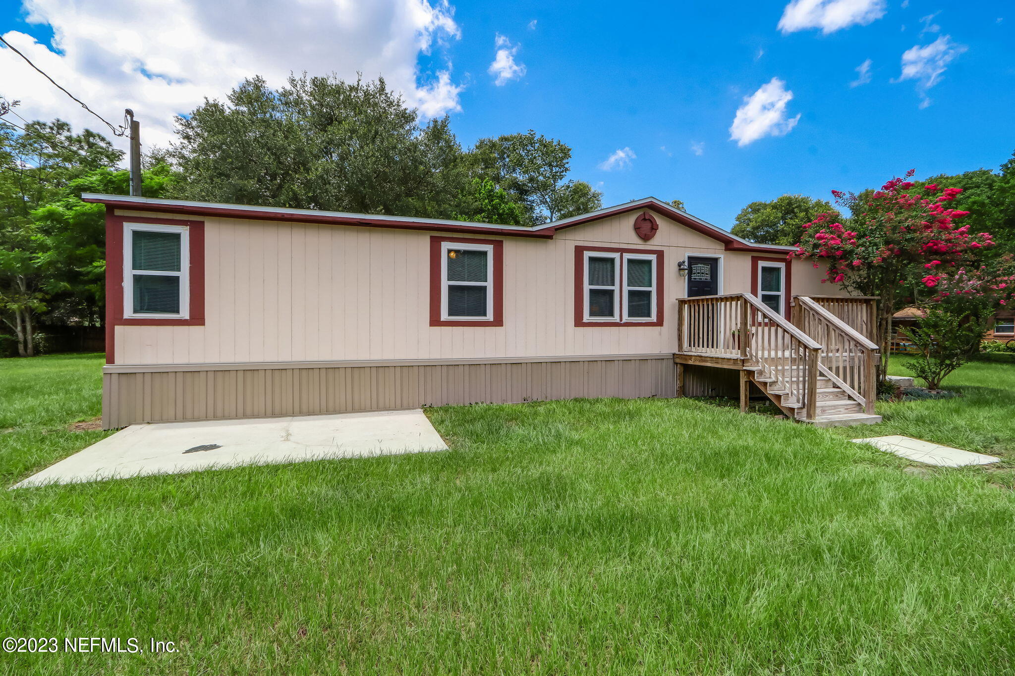 11480 Kaleel Road Jacksonville, FL 32218 - Photo 2 of 31 a house that is sitting in the grass