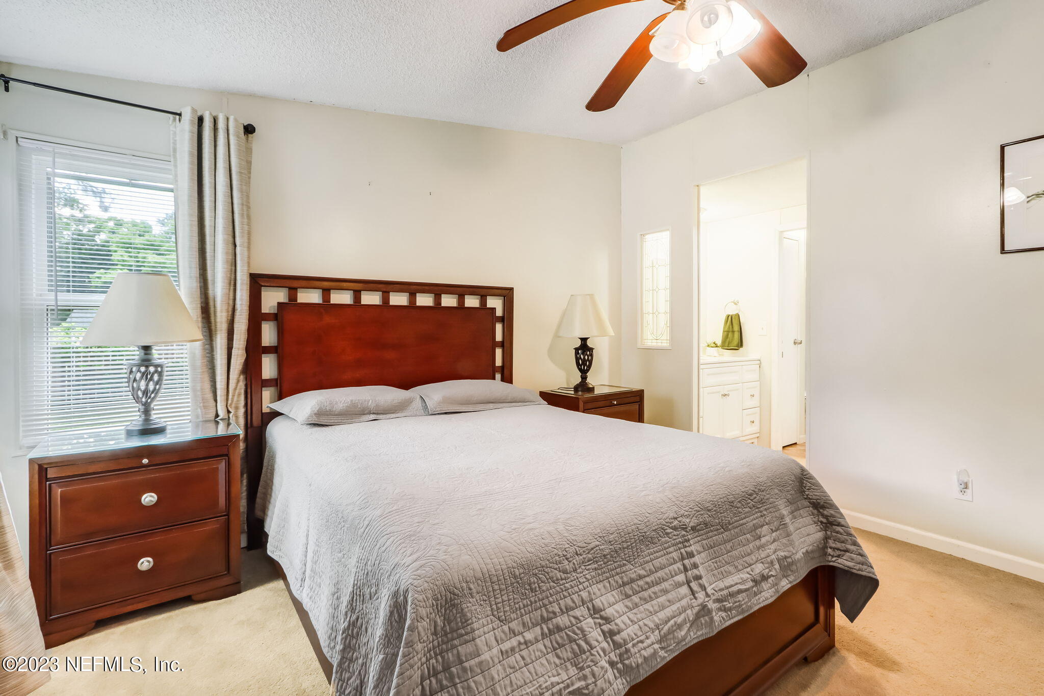 11480 Kaleel Road Jacksonville, FL 32218 - Photo 21 of 31 a bedroom with a bed and window