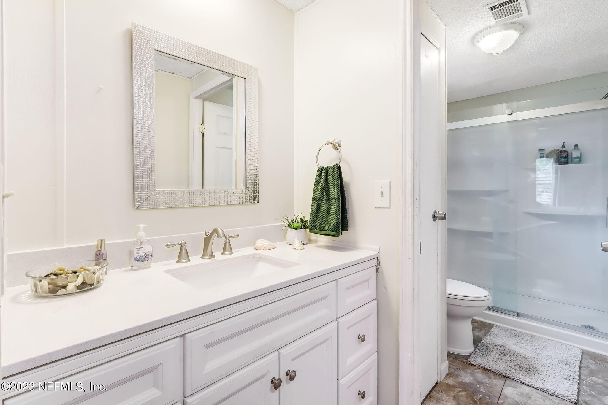 11480 Kaleel Road Jacksonville, FL 32218 - Photo 22 of 31 a bathroom with a sink a toilet and shower