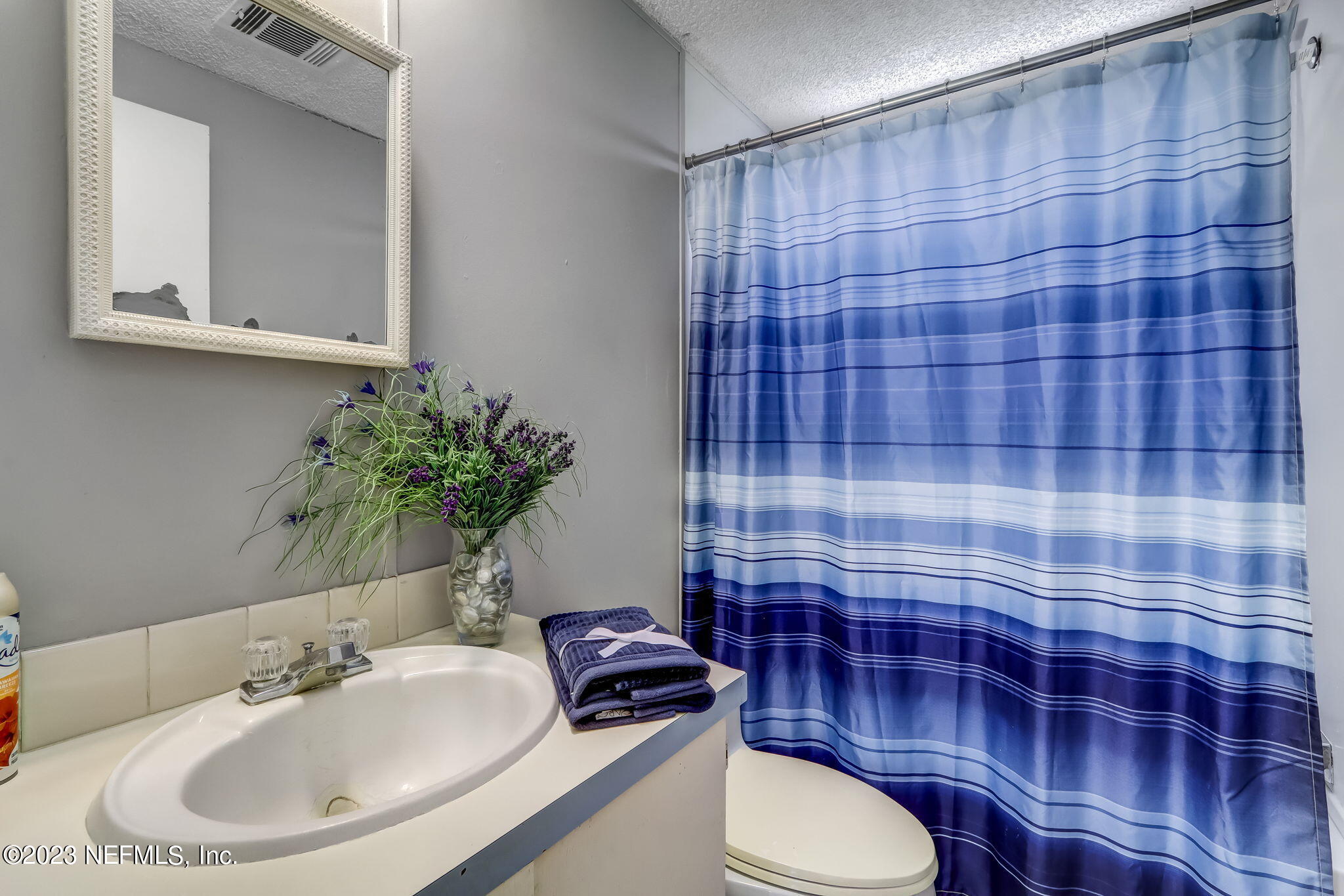 11480 Kaleel Road Jacksonville, FL 32218 - Photo 25 of 31 a bathroom with a sink toilet and shower