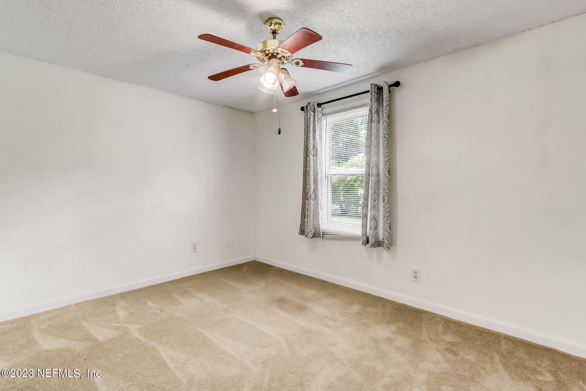 11480 Kaleel Road Jacksonville, FL 32218 - Photo 26 of 31 an empty room with a window