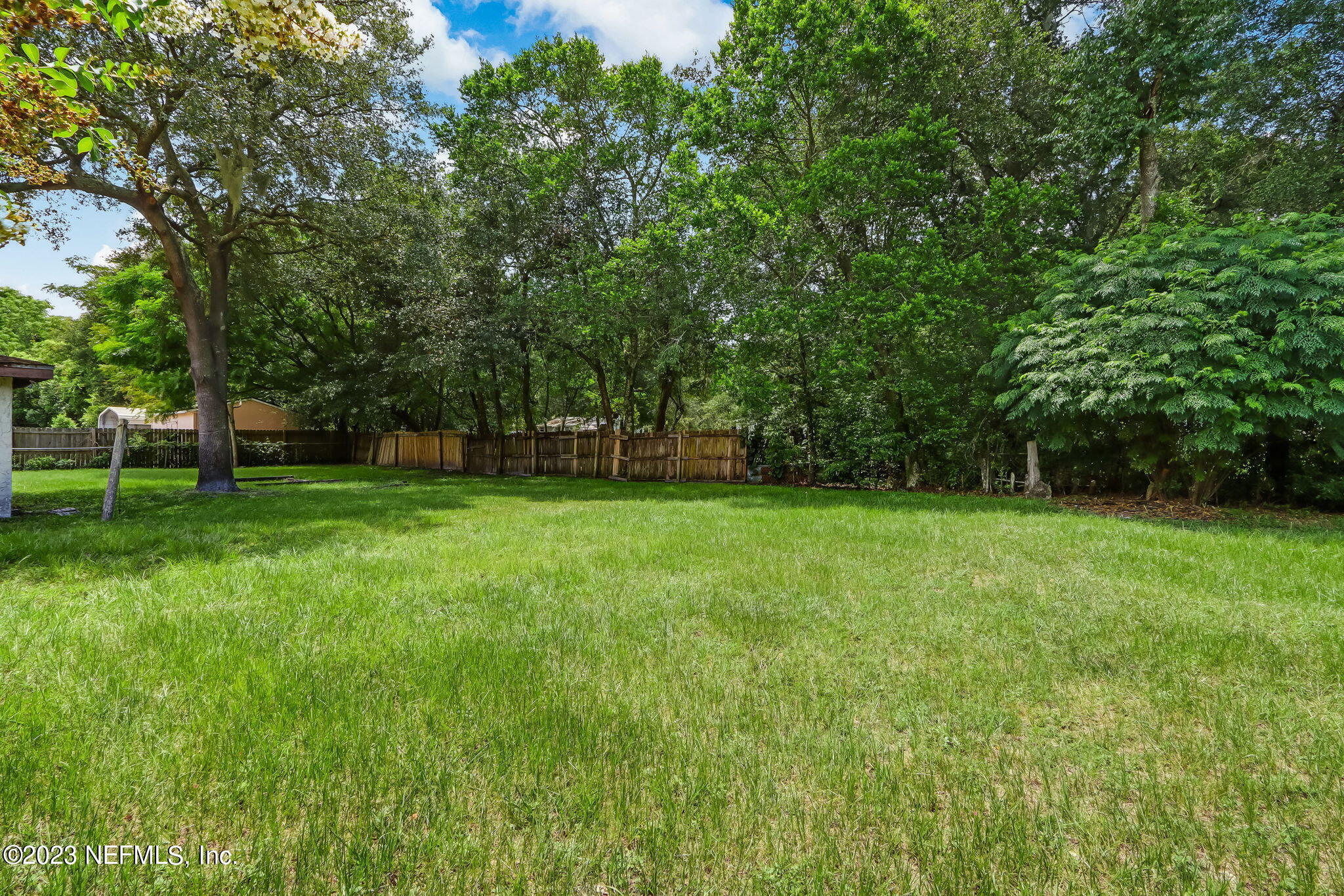 11480 Kaleel Road Jacksonville, FL 32218 - Photo 30 of 31 a view of green field with trees in the background