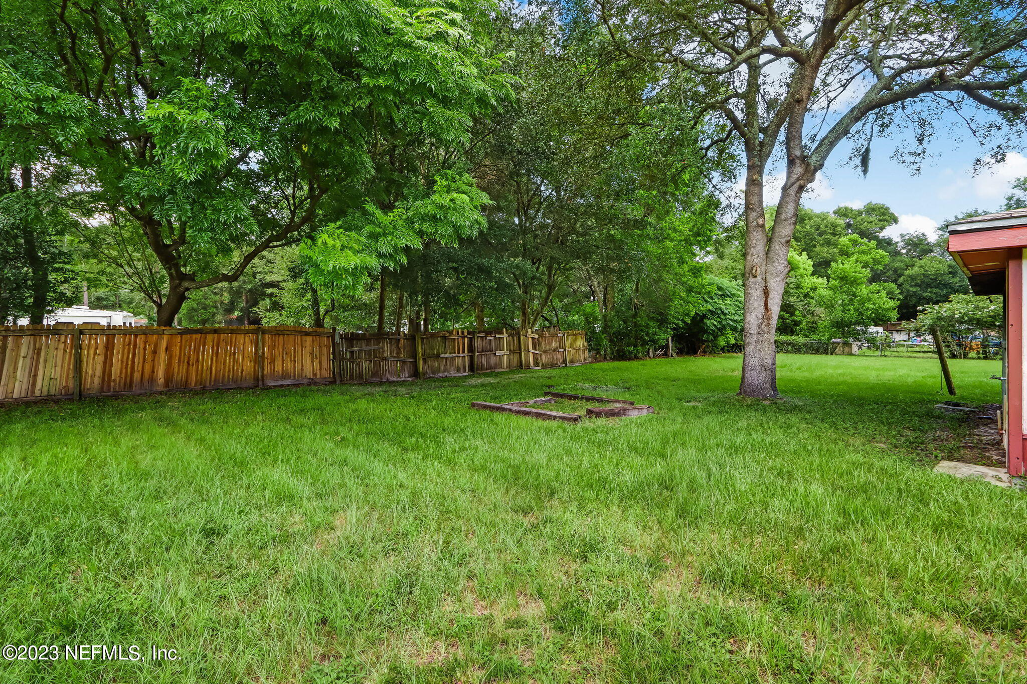 11480 Kaleel Road Jacksonville, FL 32218 - Photo 31 of 31 a view of a backyard with large trees