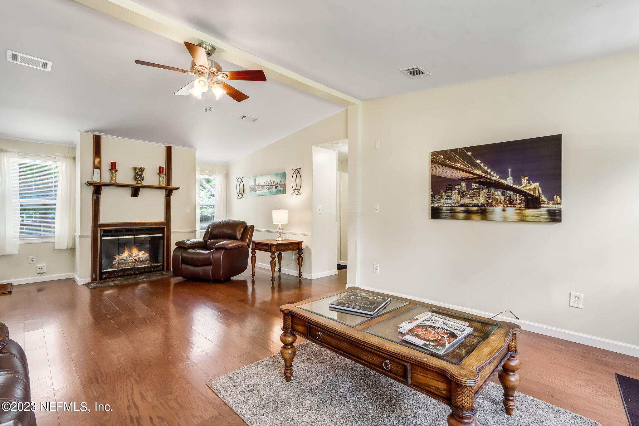 11480 Kaleel Road Jacksonville, FL 32218 - Photo 7 of 31 a living room with furniture and a wooden floor