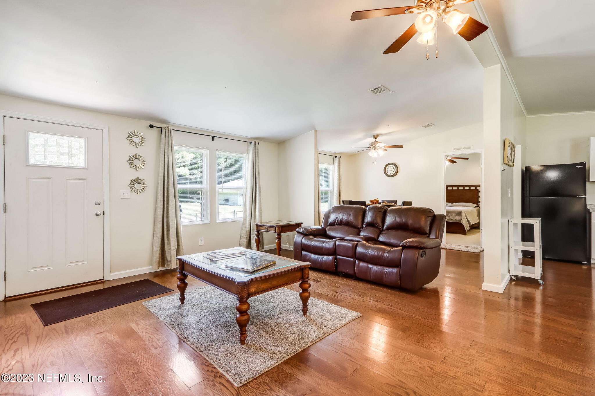 11480 Kaleel Road Jacksonville, FL 32218 - Photo 9 of 31 a living room with furniture and wooden floor