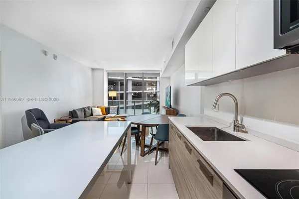 a kitchen with a table and chairs