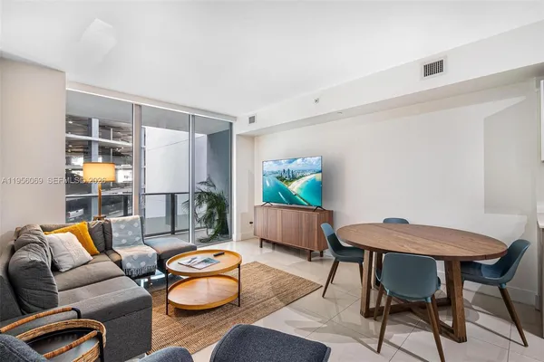 a living room with furniture and a table