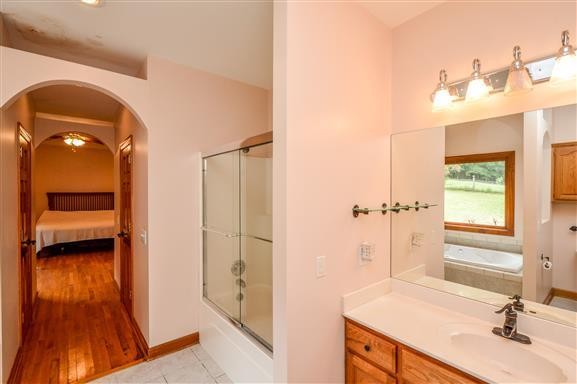 284 Northup Road Portland, TN 37148 - Photo 14 of 30 a bathroom with a sink a toilet and shower