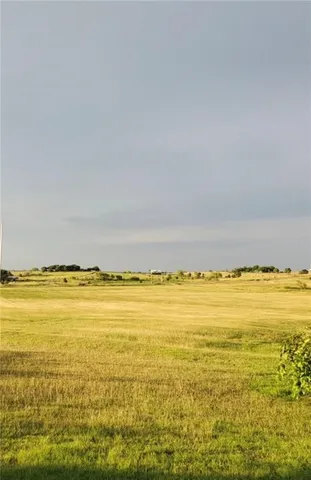a view of a lake with houses in the back