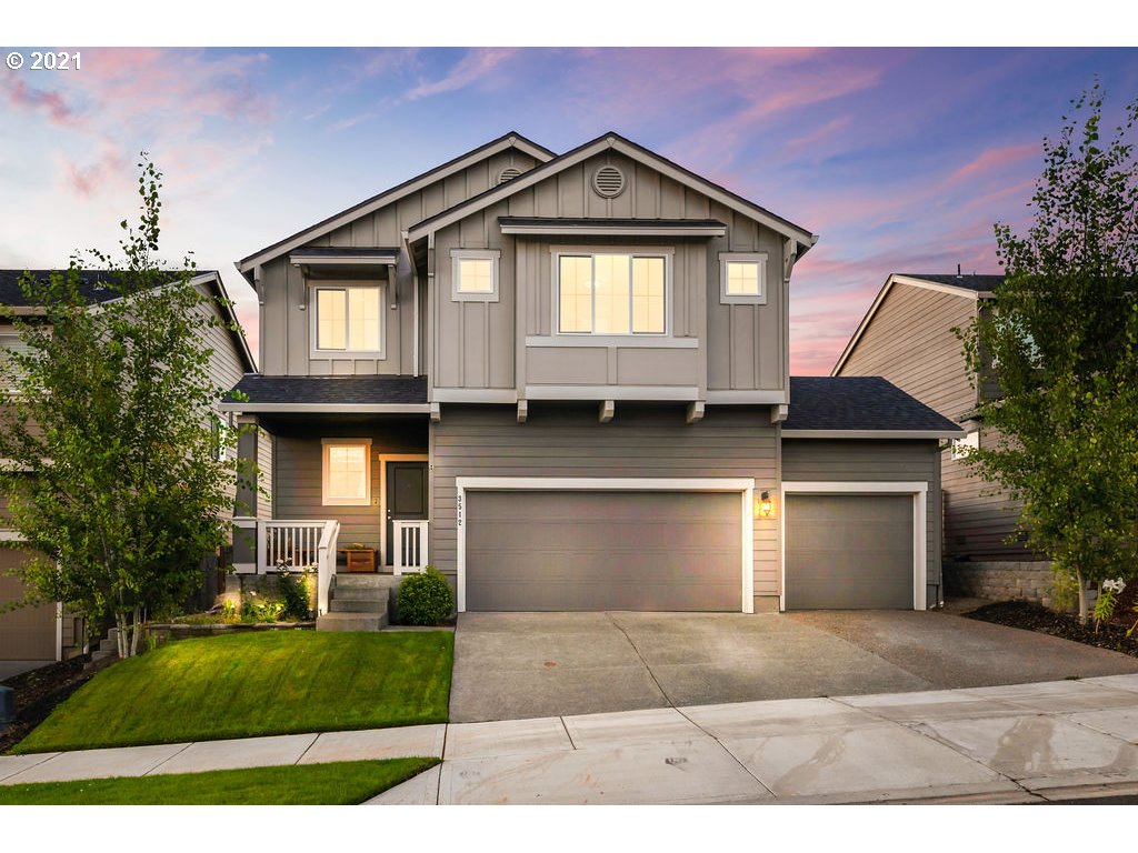 3512 North 10th Street Ridgefield, WA 98642 - Photo 1 of 23 a front view of a house with a yard and garage