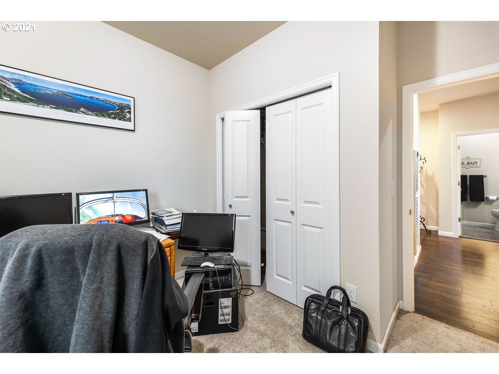 3512 North 10th Street Ridgefield, WA 98642 - Photo 11 of 23 a bedroom with a bed and a television