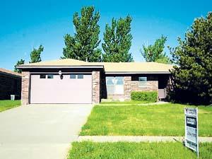 a view of house with yard
