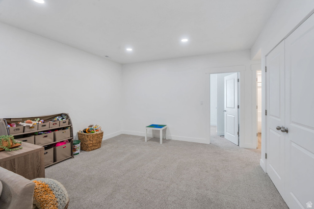 2664 West Maple Street Mapleton, UT 84664 - Photo 30 of 49 Spacious room featuring light gray carpeting, crisp white walls, recessed ceiling lighting, and white baseboards