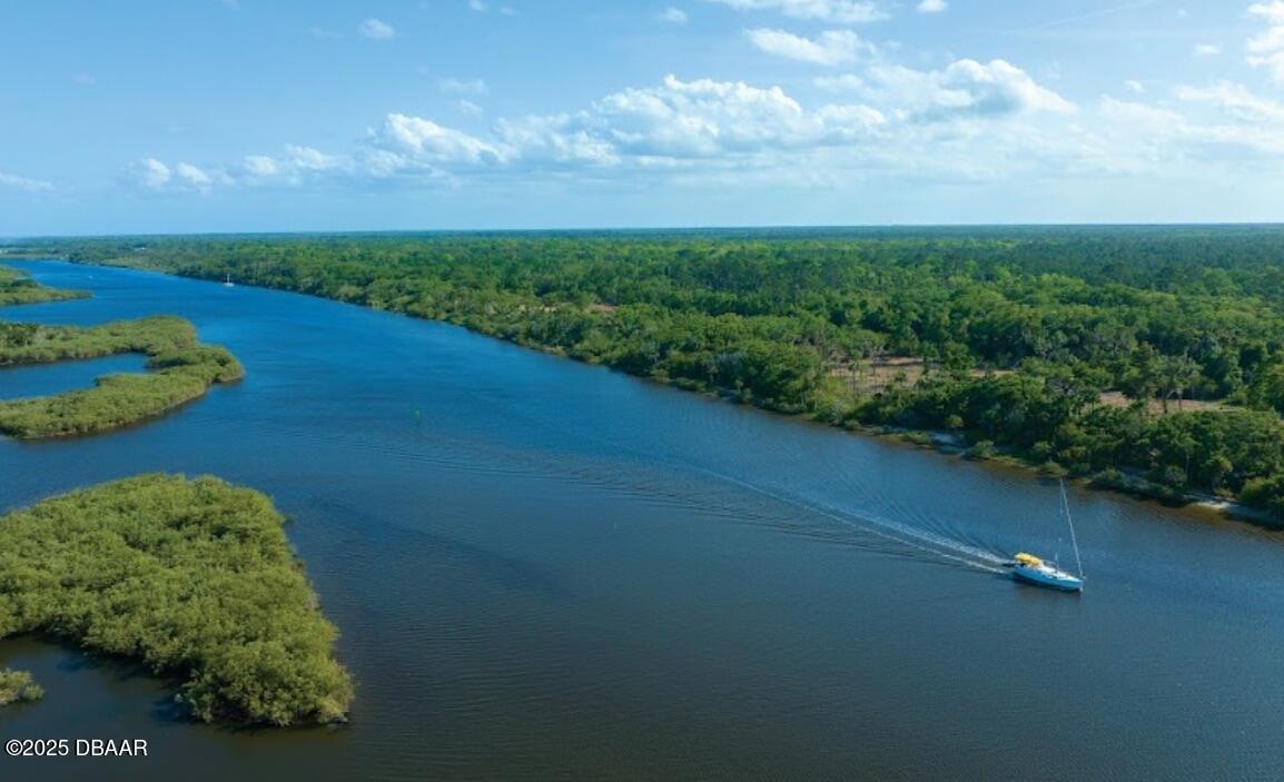a view of a garden with lawn chairs