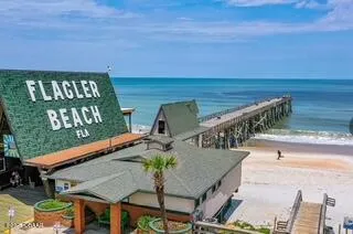 a view of a house with a tree
