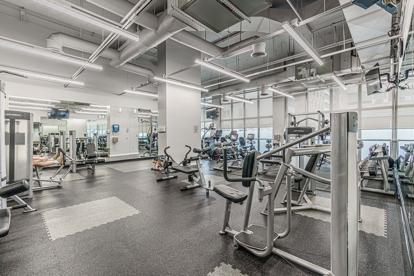 655 West Irving Park Road, Unit 3305 Chicago, IL 60613 - Photo 12 of 14 a view of a room with gym equipment
