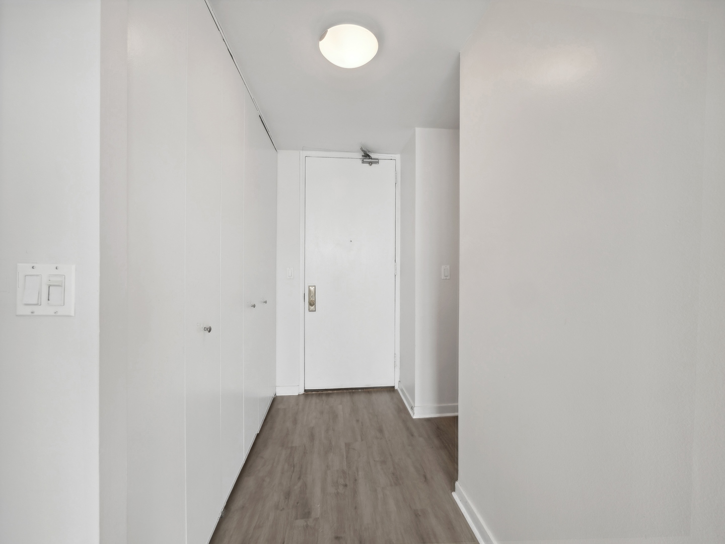 655 West Irving Park Road, Unit 3305 Chicago, IL 60613 - Photo 2 of 14 a view of a hallway with wooden floor