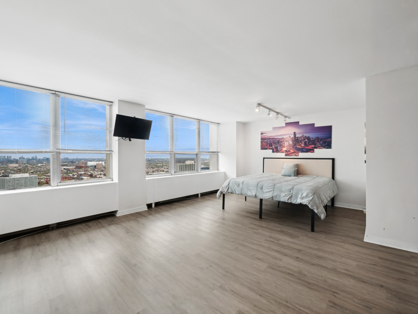 655 West Irving Park Road, Unit 3305 Chicago, IL 60613 - Photo 4 of 14 a bed room with furniture and a window