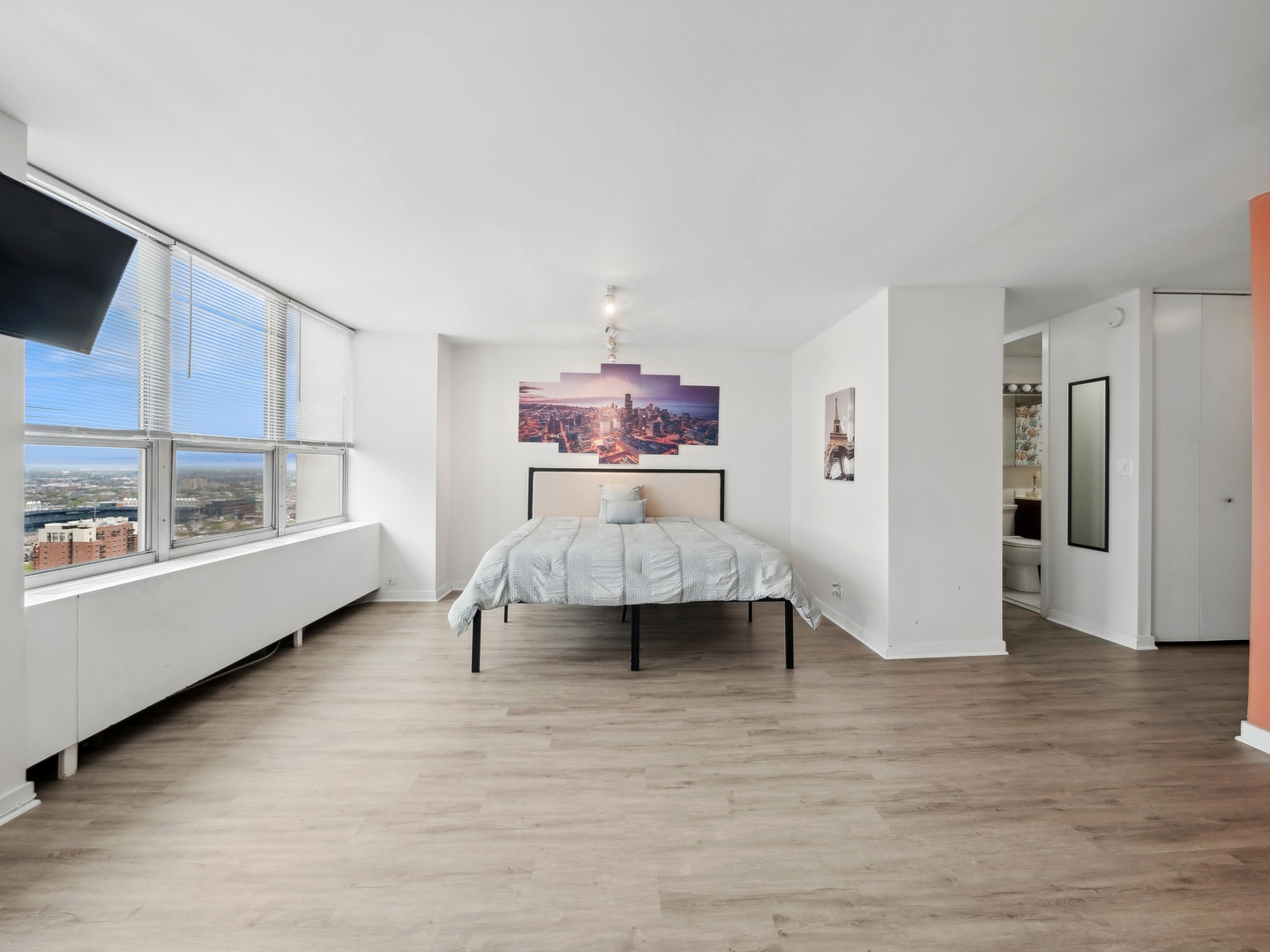 655 West Irving Park Road, Unit 3305 Chicago, IL 60613 - Photo 5 of 14 a living room with furniture and a large window
