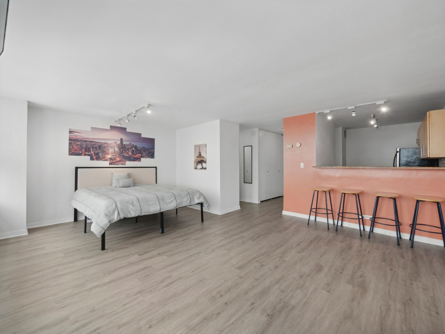 655 West Irving Park Road, Unit 3305 Chicago, IL 60613 - Photo 7 of 14 a living room with furniture and a wooden floor