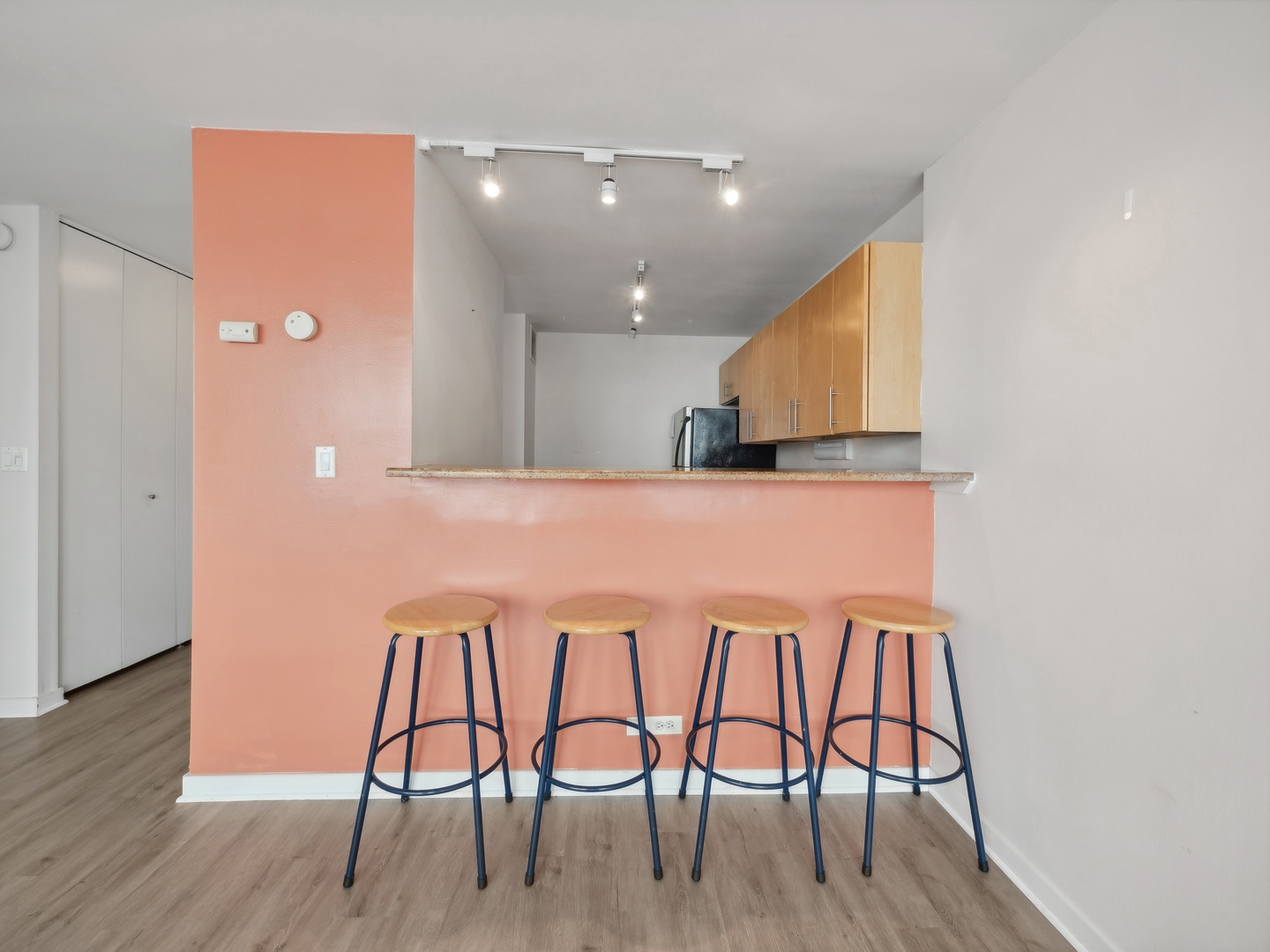 655 West Irving Park Road, Unit 3305 Chicago, IL 60613 - Photo 8 of 14 a kitchen with a table and chairs