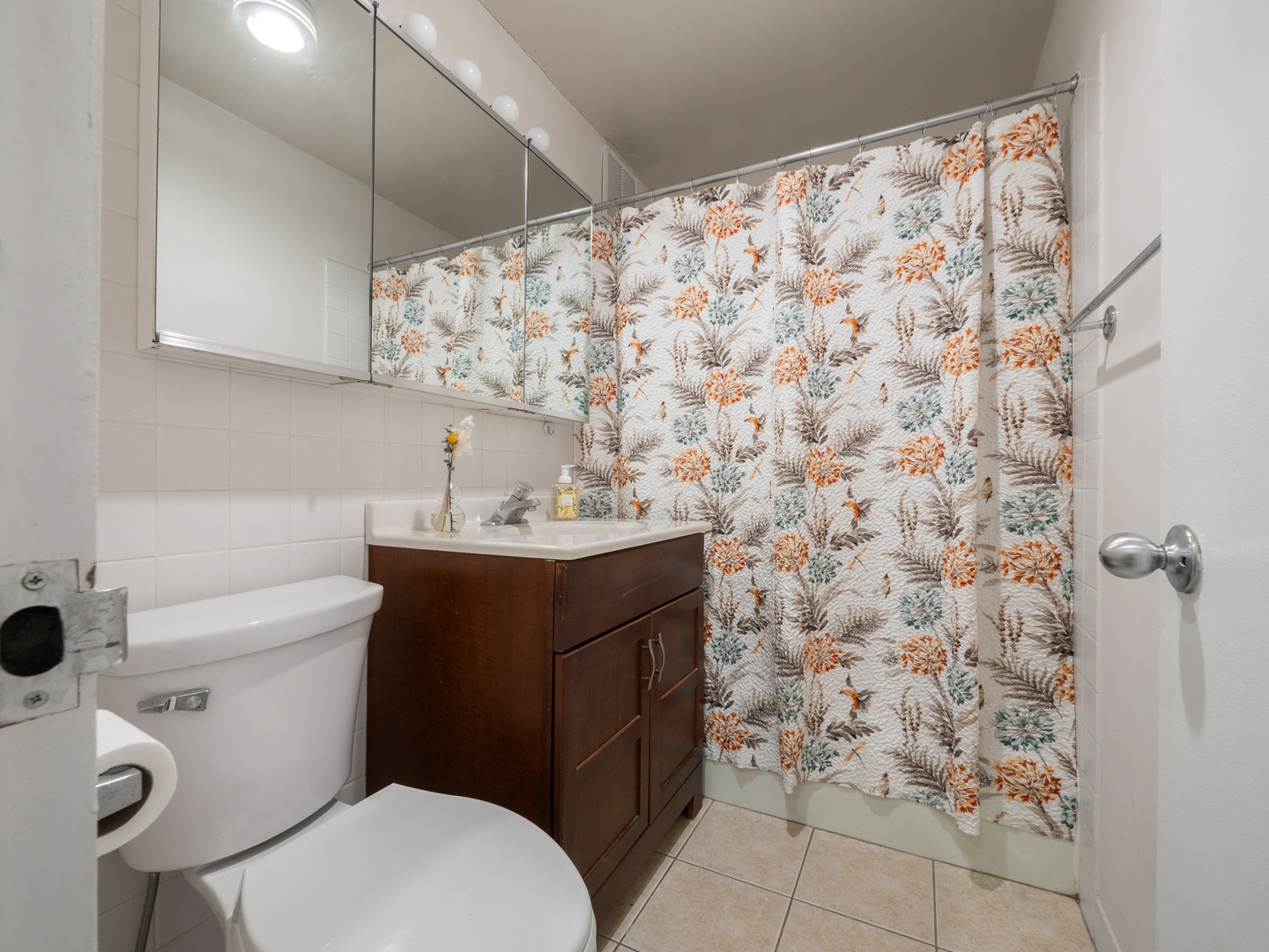 655 West Irving Park Road, Unit 3305 Chicago, IL 60613 - Photo 10 of 14 a bathroom with a sink toilet and shower