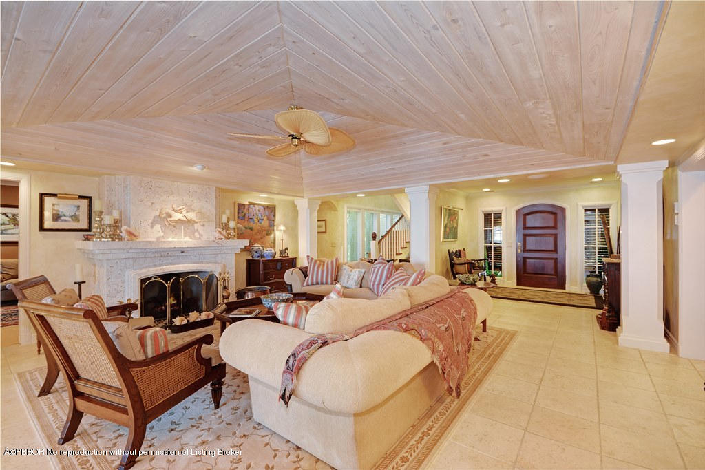 400 Caribbean Road Palm Beach, FL 33480 - Photo 2 of 45 a living room with furniture and fireplace