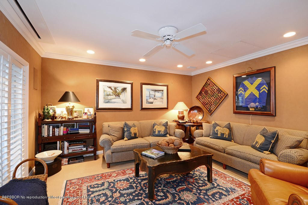400 Caribbean Road Palm Beach, FL 33480 - Photo 11 of 45 a living room with furniture and a flat screen tv