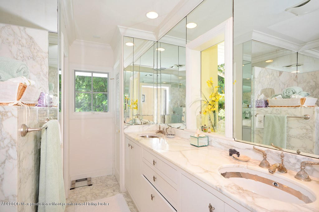 400 Caribbean Road Palm Beach, FL 33480 - Photo 14 of 45 a bathroom with a double vanity sink mirror and shower