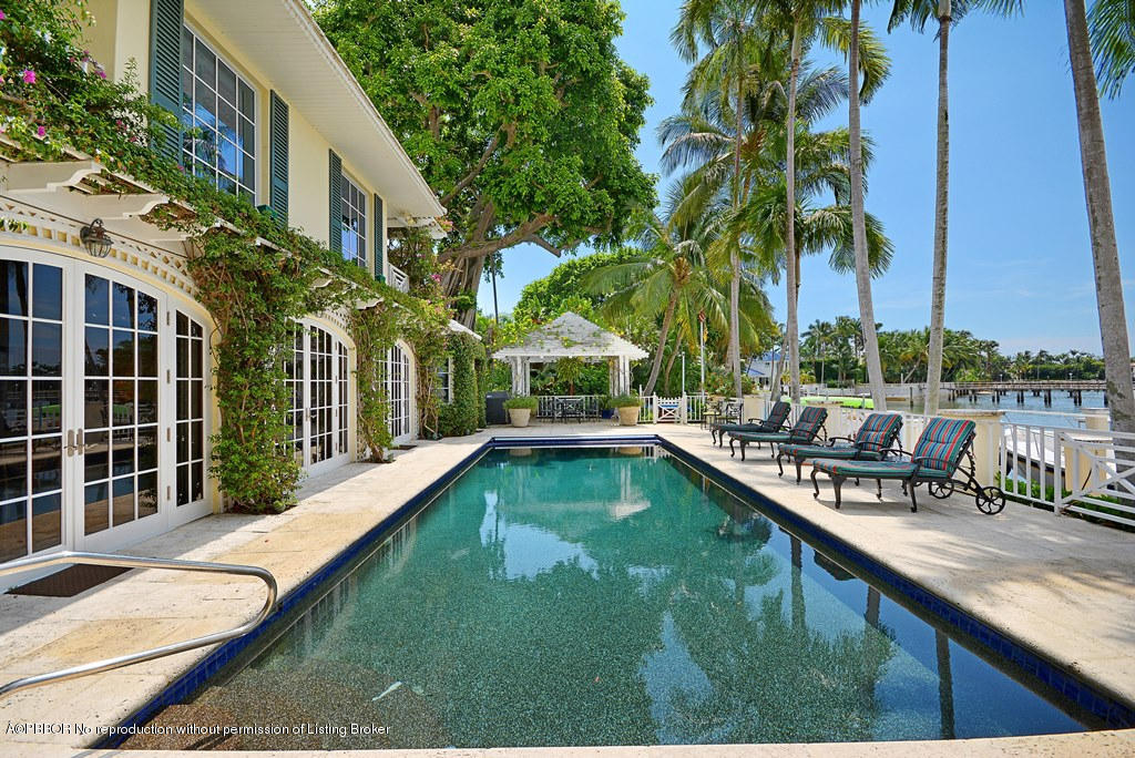 400 Caribbean Road Palm Beach, FL 33480 - Photo 20 of 45 a view of a house with a swimming pool