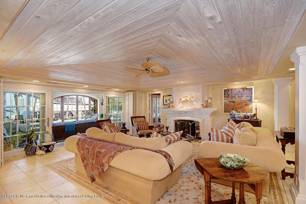 400 Caribbean Road Palm Beach, FL 33480 - Photo 3 of 45 a living room with fireplace furniture and a chandelier