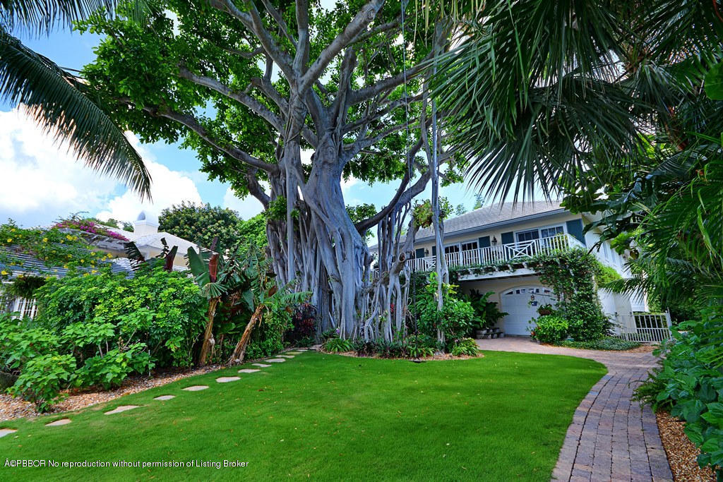 400 Caribbean Road Palm Beach, FL 33480 - Photo 29 of 45 a view of a house with a yard